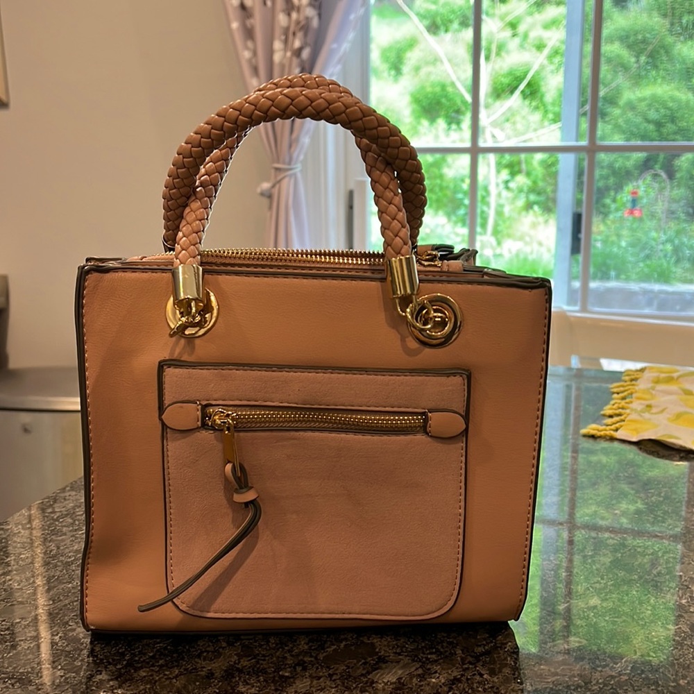 Very cute pink bag. Never used charming Charlie bag medium size